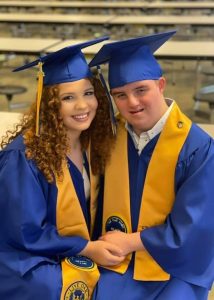 Teen with ds at graduation with his sister, 3.21 Scholarship