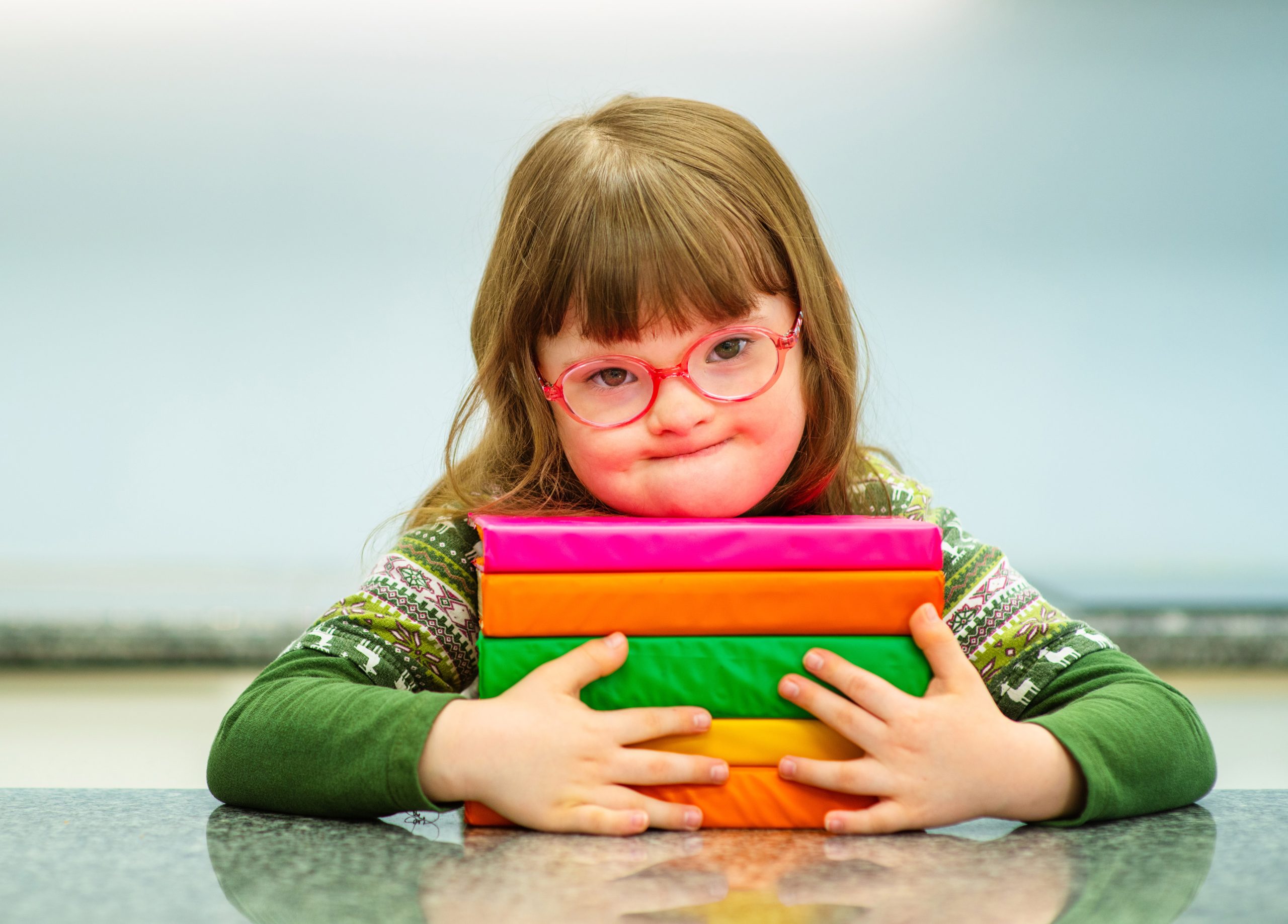down-sydrome-child-with-new-glasses Little girl with down syndrome and pink glasses, ClearVision